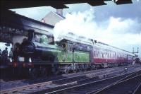 GNSR 4-4-0 No 49 <I>Gordon Highlander</I> stands at Carstairs station on 19 April 1965 with <I>Scottish Rambler no 4</I> (train B) after arrival from Leith Central.<br><br>[G W Robin 19/04/1965]