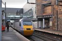 The 10.00 Kings Cross - Aberdeen East Coast service departs Haymarket on 14 January.  Above right is the 'hole in the wall' where the old footbridge exited the booking hall.<br><br>[Bill Roberton 14/01/2013]