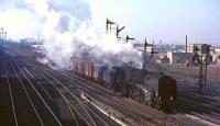 A Carlisle bound parcels train about to run past Polmadie on 30 March 1965 behind Britannia Pacific 70007 <I>Coeur-de-Lion</I>.<br><br>[John Robin 30/03/1965]