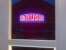 The famous neon sign, framed by the steelwork of the recently erected Loughborough station footbridge. View east in October 2013.<br><br>[Ken Strachan 25/10/2013]