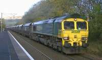 Freightliner 66536 working the 6E06 Hunterston - Cottam power station loaded coal hoppers through West Kilbride on 8 November 2013.<br><br>[Ken Browne 08/11/2013]