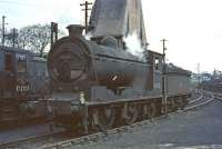 J37 0-6-0 no 64585 on Dunfermline shed in March 1964. NBL Class D2 diesel hydraulic 0-4-0 no D2707 (11707) stands in the background.<br><br>[John Robin 30/03/1964]