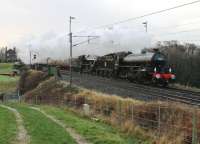 Running almost 30 minutes early, having missed out a planned stop in Barton & Broughton loop, B1 61264 and 5MT 45407 hurry the first 2014 <I>Winter Cumbrian Mountain Express</I> north through Bay Horse on 25 January 2014. The B1 replaced 5MT 44871 which was being overhauled.<br><br>[Mark Bartlett 25/01/2014]