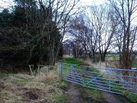 View north east from alongside the A172 along the trackbed heading towards Stokesley Station on the former route between the east coast main line at Picton and Battersby Junction.<br><br>[David Pesterfield 25/01/2014]