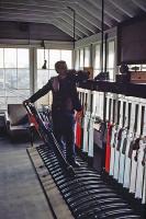 Activity inside St Botolphs signalbox, Colchester, on 27th March 1983. The signalman is on the phone making arrangements to turn an engineer's train via the Hythe triangular junction. This was a tricky task, involving reversals at Hythe and St. Botolphs in between the regular trains. The box was closed down in July that year.<br><br>[Mark Dufton 27/03/1983]