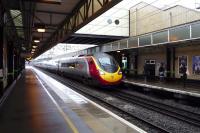 A Euston bound Pendolino arrives at Milton Keynes Platform 4 on the afternoon of 26 January 2014.<br><br>[John Steven 26/01/2014]