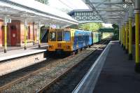 A city bound Tyne and Wear Metro service leaves Cullercoats platform 2 for St James in the summer of 2004. <br><br>[John Furnevel 10/07/2004]