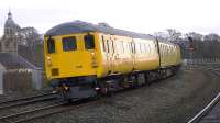 Network Rail track recording train headed by DBSO 9703 leads DRS 37603 into Kilmarnock station on 20 January 2014.<br><br>[Ken Browne 20/01/2014]