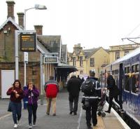 Passengers leaving the 12.42 arrival from Dalmuir at Lanark on 30 January passing those about to join the 12.53 departure for Milngavie, which it will become in 11 minutes time.  <br><br>[John Furnevel 30/01/2014]