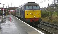 DRS 57010 and WH Malcolm liveried 66434 with the 6M22 Hunterston to Sellafield nuclear flasks passing through Ardrossan South Beach on 10 January - unusually on the platform line.<br><br>[Ken Browne 10/01/2014]