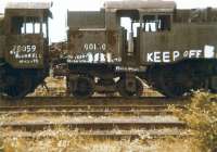 Hands off! Standard class 2 2-6-0 78059 and Standard class 4 2-6-4T 80150 at Barry on 26 July 1980. 80150 was withdrawn from Eastleigh in October 1965 and is currently undergoing restoration on the Mid Hants Railway. 78059 was withdrawn from Crewe South in November 1966 and somehow lost its tender during its time at Woodhams. The loco is currently being restored / rebuilt by the Bluebell Railway as a Standard 2-6-2 tank and will carry the number 84030.<br><br>[Colin Alexander 26/07/1980]