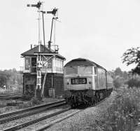 The summer Saturday 09.10 Tenby - York passes Cudworth Station signal box in August 1975 behind Brush Type 4 no 47087 <I>Cyclops</I>.<br><br>[Bill Jamieson 02/08/1975]