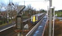 ScotRail EMU 380014 on the 12.14 Glasgow Central to Ayr service passes through Barassie on 23 January 2014.<br><br>[Ken Browne 23/01/2014]