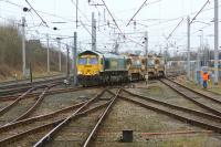 Freightliner 66620 departs from No2 Up & Down Goods loop at Carnforth with 6Y30 Crewe Basford Hall to Penrith engineers working on 1 February 2014.<br><br>[John McIntyre 01/02/2014]