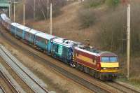 The latest addition to the DRS fleet and first of the new Class 68 locomotives on a test run from Carlisle Kingmoor to Crewe on 4 February 2014. For this first trip out no 68002 was hauled by 90020 with eleven coaches, seen here passing Farington Curve Junction. The train returned to Carlisle later in the afternoon. [See image 46189]<br><br>[John McIntyre 04/02/2014]