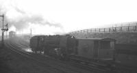 A February morning at Annfield East in 1964, as BR standard class 9F 2-10-0 no 92063 works hard on the rear of a Consett bound iron ore train. Sister locomotive 92066 is on the front of the train [see image 23835].<br><br>[K A Gray 15/02/1964]