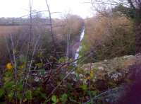 The Serene and Delightful looking trackbed at Horsington, just North of Templecombe, in December 2013. The route is nowadays used as a farm track; and is therefore rather potholed and damp.<br><br>[Ken Strachan 27/12/2013]