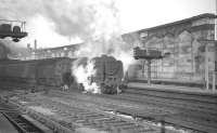 The combined 10.5am ex-Glasgow Central/10.10am ex-Edinburgh Princes Street about to restart from Carlisle on 30 January 1965 and continue its journey south to Birmingham New Street. The locomotive in charge of the combined train is Upperby Britannia Pacific no 70032 <I>Tennyson</I>.<br><br>[K A Gray 30/01/1965]