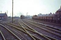 Looking south along the WCML from Carstairs on a rainy 24 July 1964 as 46255 <I>City of Hereford</I> approaches the station with a Perth train.<br><br>[John Robin 24/07/1964]