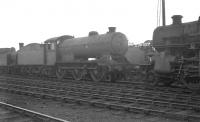 Locomotives in the shed yard at Carlisle Canal on 12 April 1963. Centre stage is Gresley J39 0-6-0 no 64899, a resident here throughout the BR period. The locomotive had been officially withdrawn 6 months earlier and was awaiting transfer to Cowlairs, where it was cut up the following month. [Ref query 6567]<br><br>[K A Gray 12/04/1963]