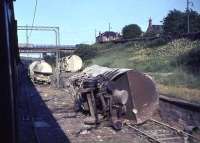 Wreckage of a derailed cement train at Uddingston Junction in July 1965.<br><br>[John Robin 17/07/1965]