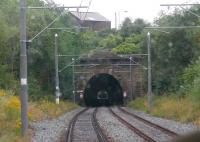 A last ride through Werneth Tunnel, and Central Tunnel beyond, on a Rochdale bound tram using the old route through Oldham in July 2013. The tram is just passing through the site of Oldham Werneth station, which closed in 2009. This section of line finally closed to all traffic on 18th January 2014 and nine days later the first trams ran through Oldham Town Centre on the street running section. <br><br>[Mark Bartlett 31/07/2013]