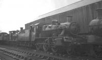 BR Standard class 2 2-6-0 no 78052 stands alongside Bathgate shed in February 1966. Built at Darlington Works in November 1955, the locomotive had been withdrawn by BR the previous month and was cut up at MMC Wishaw two months later.<br><br>[K A Gray 05/02/1966]