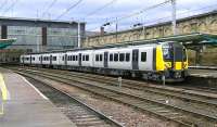 A new TransPennine class 350/4 EMU departs from Carlisle with 1M95 from Edinburgh to Manchester International Airport on its first week in operational service.<br><br>[Ken Browne 05/02/2014]