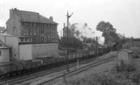 A pickup freight, including empty newsprint wagons from Hairmyres, photographed at Clarkston on a grey July day in 1962. Corkerhill Black 5 no 45361 is at the head of the train.<br><br>[John Robin 17/07/1962]