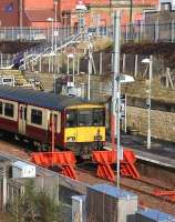 The 12.06 service to Dalmuir awaits its departure time at Larkhall on 30 January 2014. <br><br>[John Furnevel 30/01/2014]