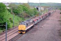 An <I>InterCity</I> liveried class 37 locomotive leaving Millerhill Yard in September 1991 with a ballast train.<br><br>[John Furnevel 07/09/1991]