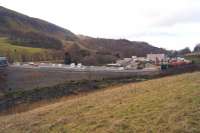 A view of the temporary <I>village</I> created by Network Rail and their contractor for the major engineering work being undertaken on Holme Tunnel between Hall Royd Junction, Todmorden and Burnley Manchester Road station. A roadway has been constructed from the buildings (right) to the trackside (left). <br><br>[John McIntyre 10/02/2014]