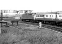 A northbound excursion has just taken the York station avoiding line at Holgate Junction on 13 July 1980. One of York shed's own stud of class 47s no 47549 is at the head of the train. [See image 32251]<br><br>[John Furnevel 13/07/1980]