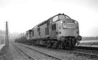 EE Type 3 No D6857 lifts a block train of empty oil tanks away from Granton. The loco was allocated to Eastfield at the time, suggesting this is the Q (as required) working from Granton to Grangemouth, booked to depart at 10:25. Thought to have been taken on 16th March 1970<br><br>[Bill Jamieson 16/03/1970]