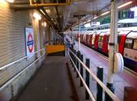 Beyond the yellow brick wall: a DDA compliant ramp leads from the low level entrance and ticket hall at High Barnet to platform 1 [see image 45492].<br><br>[Ken Strachan 05/08/2013]