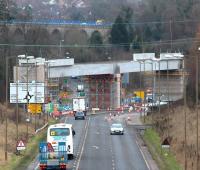 Long lens view south towards Hardengreen roundabout on Monday 18 February 2014 showing the new bridge over the roundabout and the older (by 167 years) Newbattle Viaduct standing beyond. <br><br>[John Furnevel 18/02/2014]