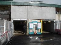 The current south side entrances to Cardiff Central, making use of the east end subway, with the right side entrance for Valley line platforms 6 & 7 only and the left side entrance for all other platforms. To the right of the entrance is a section of the new retaining wall being created forward of the old one to make space for an extra running line through the new platform 8, being created to the left of view.<br><br>[David Pesterfield 13/02/2014]