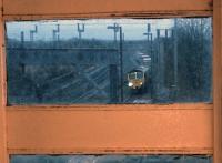 <I>Yesterday upon the stair, I met a train that wasnt there...</I> (With apologies to William Hughes Mearns]. Something different: 66538 hauling a container train North on the down slow, approaching platform 1 at Tamworth Low Level. Photographed on 14 February from the High Level station waiting room off platform 4.<br><br>[Ken Strachan 14/02/2014]