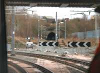 <I>Not your regular railway/tramway sign</I>. Approaching the site of Oldham Werneth station in February 2014 tram drivers were confronted by these road style chevron boards. Understandable I suppose as until the previous month they continued straight on through the tunnels but are now faced with a tight 90 degree turn onto the new town centre line. Viewed from behind the driver of a Rochdale bound tram, [See image 44091] for the same location in 2013. By August 2014 the tracks and catenary through the tunnels had been removed, probably for use elsewhere as Metrolink is extended.   <br><br>[Mark Bartlett 13/02/2014]