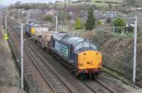 DRS EE Type 3s 37601 and 37425 trundle slowly southwards on the WCML at Bolton-le-Sands on 20 February. The train, comprising two empty flasks from Sellafield for Heysham Power Station, will take the chord at Hest Bank for the Morecambe Branch.<br><br>[Mark Bartlett 20/02/2014]