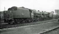 The shed yard at Corkerhill on 31 May 1964. Black 5s 45256 (Stockport Edgeley) and 45028 (Carlisle Kingmoor) have recently arrived on shed following a visit to Cowlairs Works.   <br><br>[John Robin 31/05/1964]