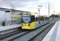 A Rochdale to East Didsbury (via Manchester) tram calls at the new street level stop of South Chadderton on a gloomy February morning. Ahead of 3020 is the short rise that will take it back onto the original L&Y railway formation to continue down to Hollinwood and Failsworth. [See image 46324]<br><br>[Mark Bartlett 13/02/2014]