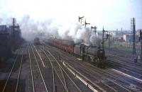 Black 5 44801 about to pass below Polmadie bridge on 23 May 1964 with a special for Abergavenney. The EE Type 1 shrouded in smoke on the left appears to be waiting to cross over onto Polmadie shed. <br><br>[John Robin 23/05/1964]