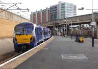 334021 departs Exhibition Centre with an eastbound train on 22 February 2014 passing errr.... [see image 4786]<br><br>[Bill Roberton 22/02/2014]