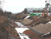 The trackbed running past Lady Victoria towards Newtongrange on 22 February. The bridge carrying the A7 Murderdean Road stands in the background with the houses of Station Road beyond. The new station site is on this side of the bridge.<br><br>[John Furnevel 22/02/2014]