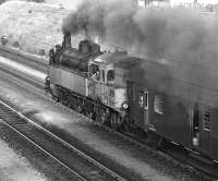 Pacific tank No. 77.66 heads a late afternoon commuter train from Vienna Praterstern  to Bernhardsthal on 30 August 1974. The shot was taken at Deutsch-Wagram on the Nordbahn, the first steam-worked line to be built in the Austrian empire.         <br><br>[Bill Jamieson 30/08/1974]