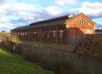 The first Bridge Street loco shed was built in 1845, but blew down in 1852. The replacement was started in 1855 and extended in 1870. The building became a carriage shed in 1881 and is now used for storage by Network Rail. The Asda supermarket on the extreme left is on the far side of Bridge Street level crossing [see image 19770].<br><br>[Ken Strachan 21/02/2014]