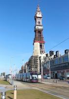With a familiar (if partly shrouded) landmark dominating the promenade backdrop, <I>Flexity</I> 001 leaves the Tower tram stop heading south on a bright February morning.<br><br>[Mark Bartlett 27/02/2014]
