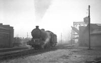 A Q7 0-8-0 moves slowly through the shed yard at Darlington on a misty morning in the early 1960s.<br><br>[K A Gray //]