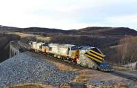 With snowploughs front and rear, 37606 and 37218 leave the south end Slochd Viaduct on 28 February 2014 heading for Motherwell.<br><br>[John Gray 28/02/2014]